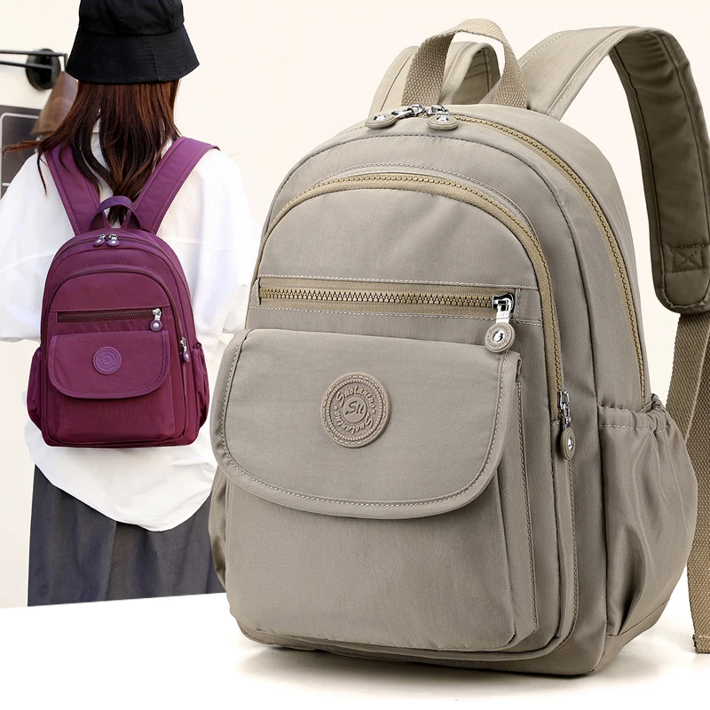 Lightweight Black Nylon Women's Travel Backpack with Zipper Compartments for Commuting and School - Image 3