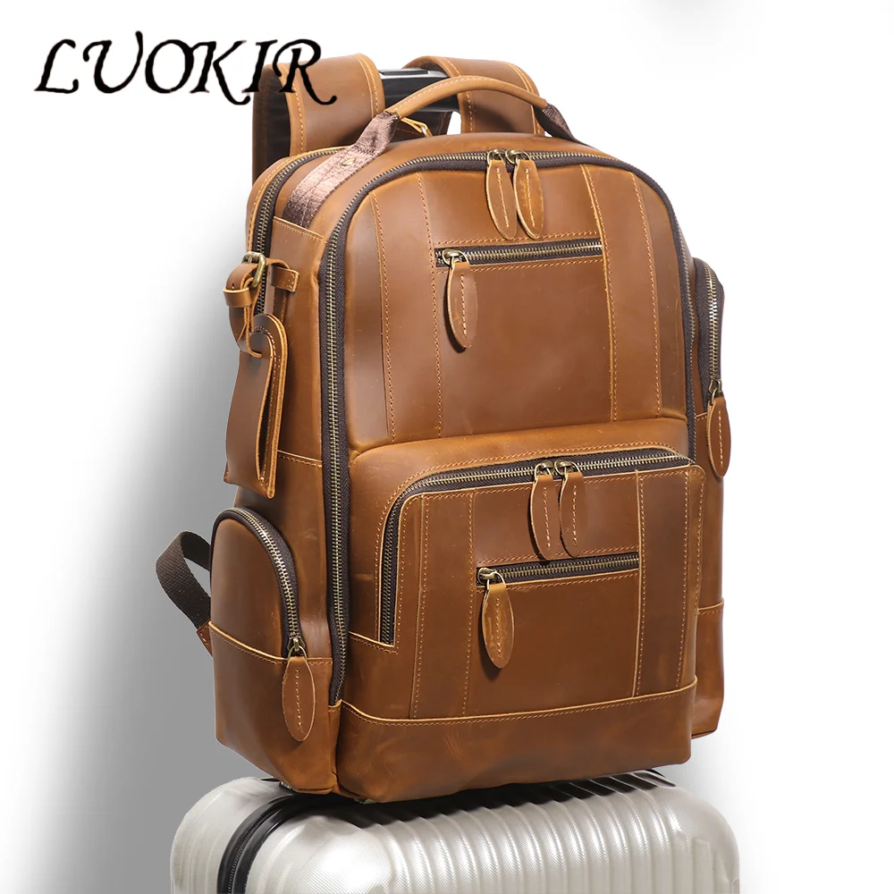 Leather travel backpack showing proper carry-on dimensions and compartments